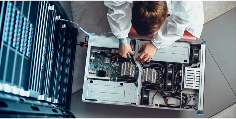 technician providing data center maintenance services on motherboard